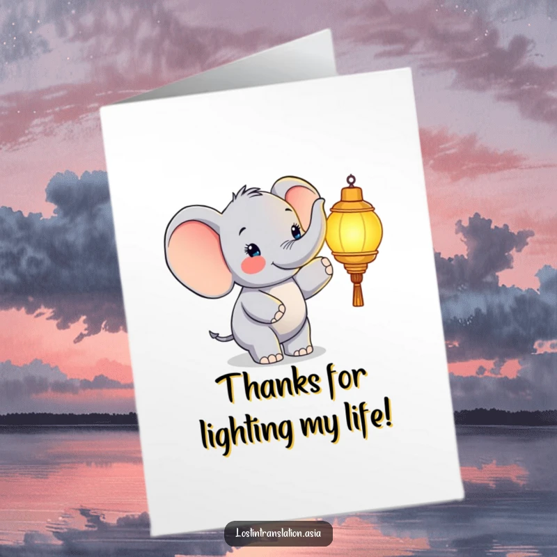 Funny free printable thank you card featuring a happy elephant highlighting a soft glowing lantern, a warm thank you.