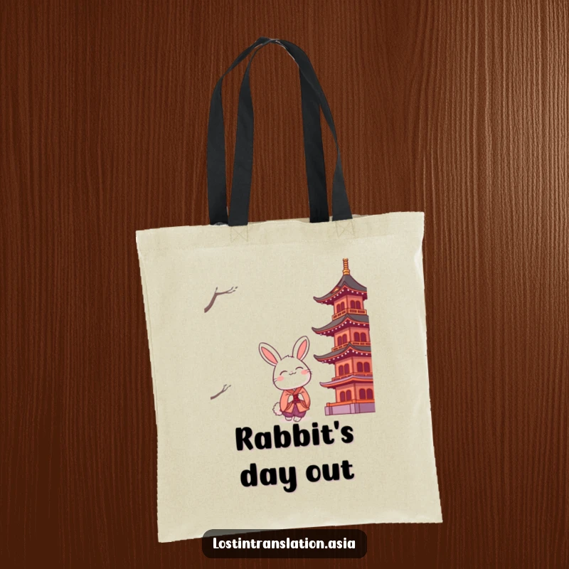 Funny smiling rabbit in a kimono is depicted looking up at a large, stylized pagoda, perfect for carrying essentials.